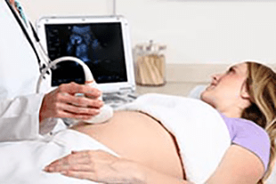 a woman is having a private pregnancy scan