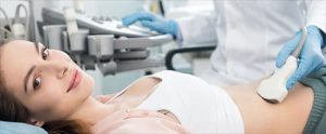 A woman is having a private abdominal and urinary tract ultrasound in London